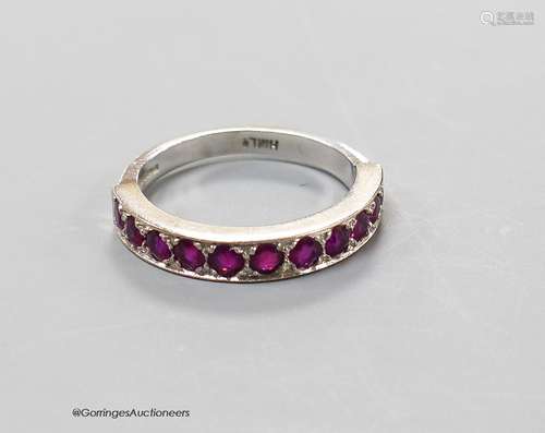 A modern 18ct white gold and eleven stone ruby set half eter...