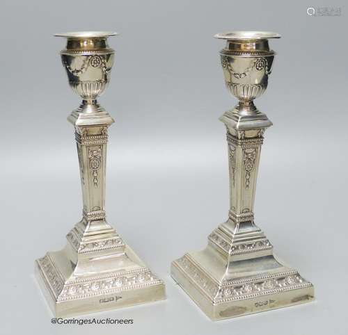 A pair of Edwardian silver pillar candlesticks, by Walker & ...