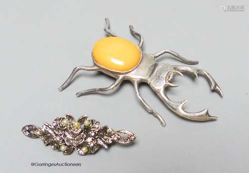 A silver and amber stag beetle brooch