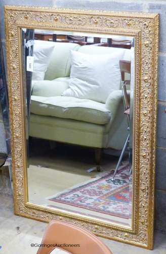 A rectangular Victorian style gilt wall mirror, 80 x 110cm.