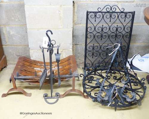 A cast and wrought iron fire grate, spark guard, fire implem...