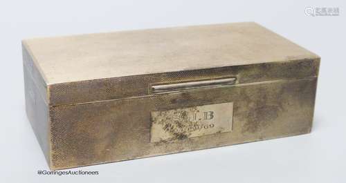 A late 1960's engine turned rectangular silver cigarette box...