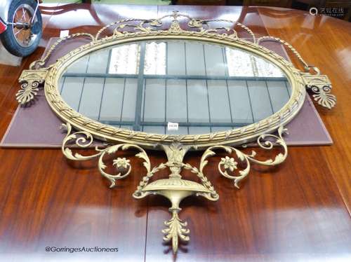 A 19th century regency style oval gilt wood and gesso wall m...