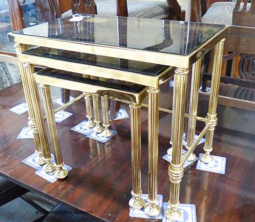 Two nests of gilt metal and glass tables and a similar coffe...