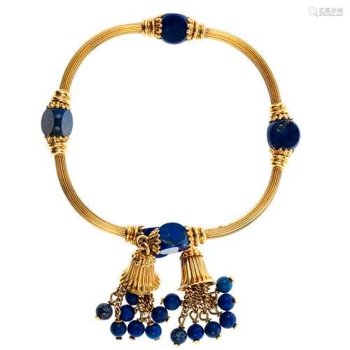 Bracelet jonc ouvert serti de lapis lazuli terminé par des m...