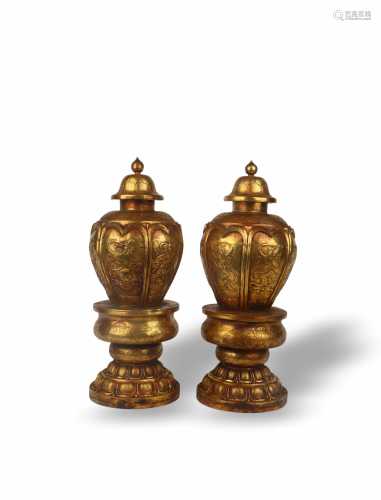 A PAIR OF GILT COPPER LIDDED POTS