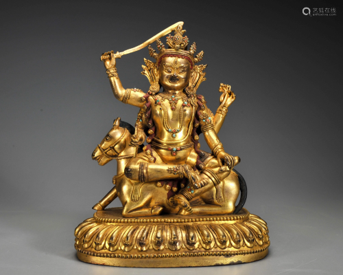 A Tibetan Gilt-bronze Seated Protector