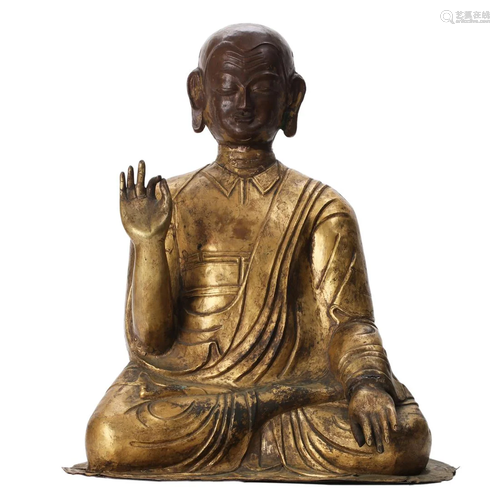 A BRONZE FIGURE OF A SEATED LAMA