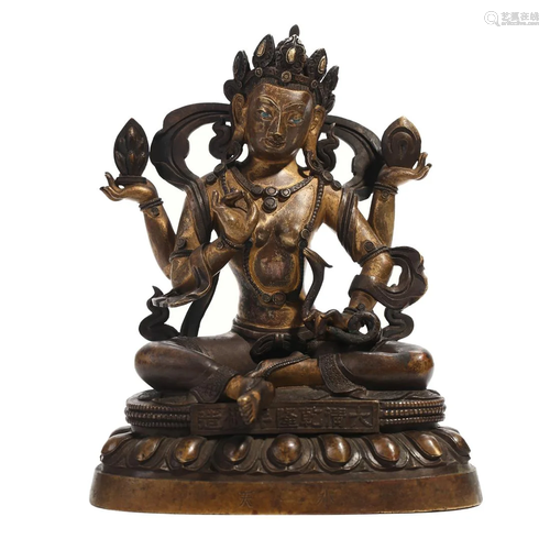 A BRONZE FOUR-ARMED BUDDHA FIGURE