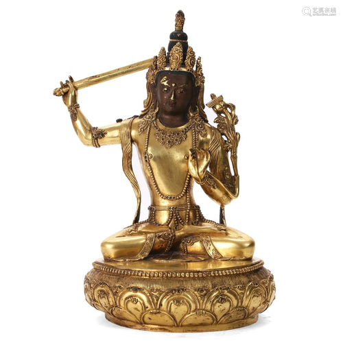 A GILT-BRONZE FIGURE OF MANJUSHRI