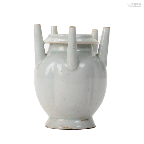 A WHITE-GLAZED VASE