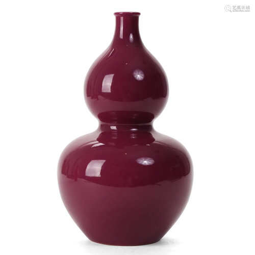 A RED-GLAZED GOURD-FORMED VASE