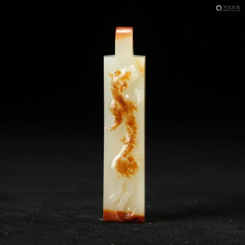 A WHITE AND RUSSET JADE PENDANT