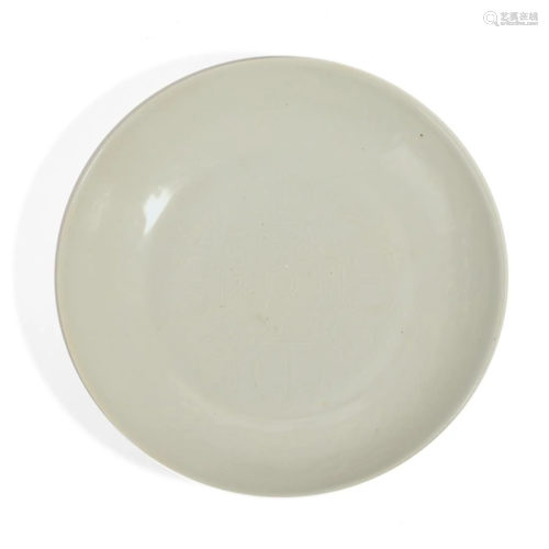 A WHITE-GLAZED FLORAL DISH