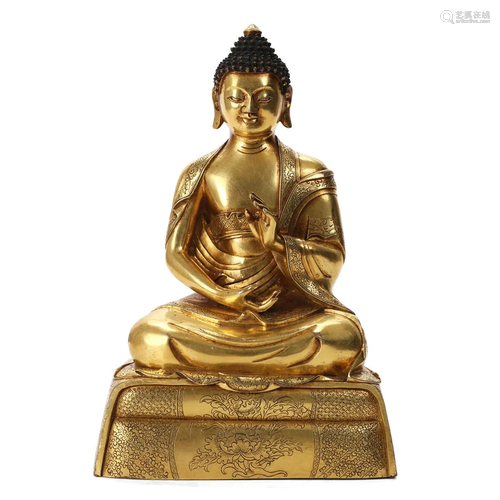 A GILT-BRONZE FIGURE OF SHAKYAMUNI