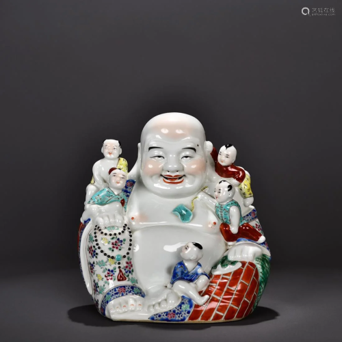 FAMILLE ROSE PORCELAIN FIGURINE OF BUDDHA AND KIDS