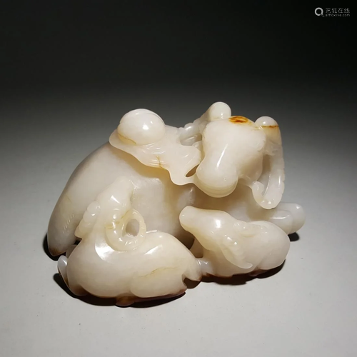 OPENWORK RUSSET JADE CARVING OF THREE RAMS