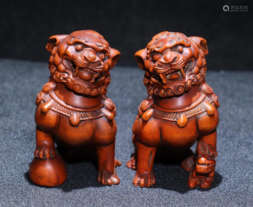 Pair of Chinese Huangyang Wood Carved Lions