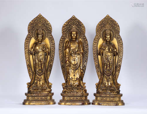 A Group of Three Standing Buddha Xuande Style