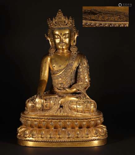 A MING DYNASTY YONGLE GILT BRONZESAKYAMUNI BUHHDA STATUE