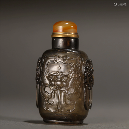 A Chinese Carved Crystal Beast-Face Snuff Bottle