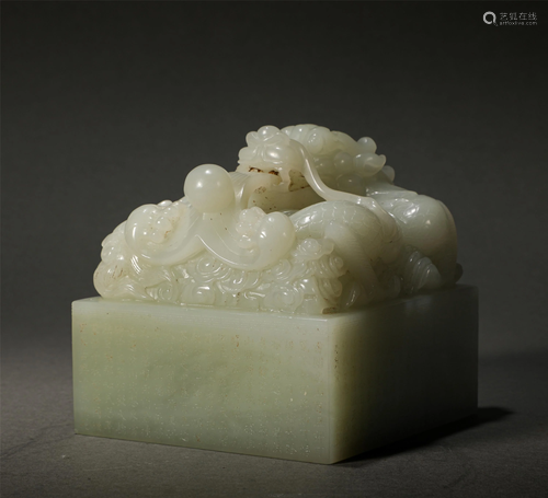 A Chinese Inscribed White Jade Dragon Seal