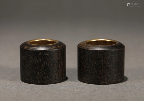 Pair of Silver Mounted Chenxiang Wood Thumb Rings