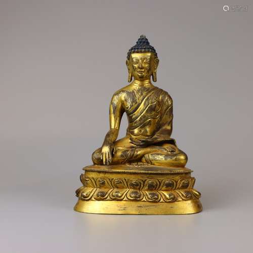 GILT BRONZE FIGURE OF SHAKYAMUNI     Seated on a double-lotu...