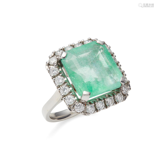 An emerald and diamond cluster ring