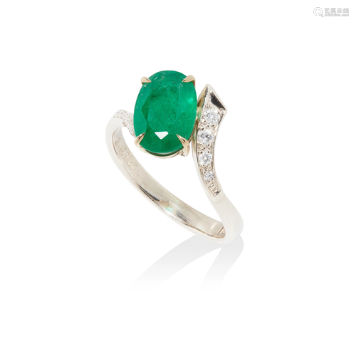 An emerald and diamond ring