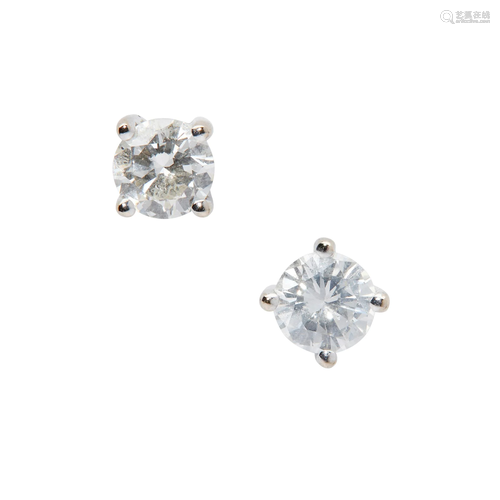 A pair of diamond stud earrings