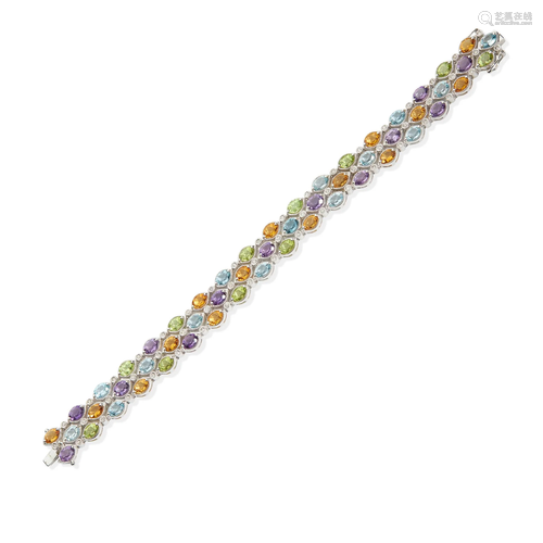 An 18ct gold diamond multi-gem bracelet