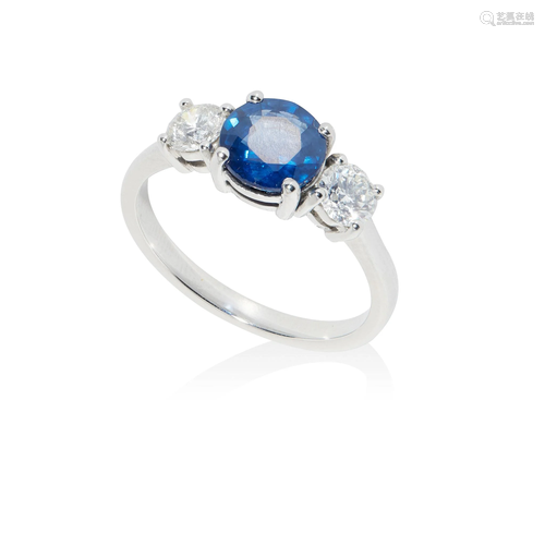 A sapphire and diamond three-stone ring