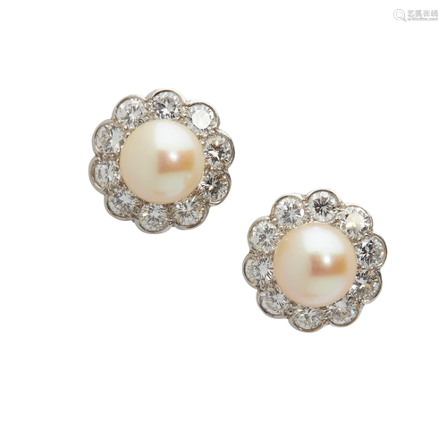 A pair of pearl and diamond cluster earrings