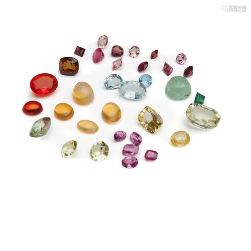 An unheated yellow sapphire and various loose gemstones