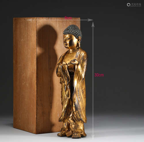 In the Ming Dynasty, a bronze gilded statue of Sakyamuni Bud...