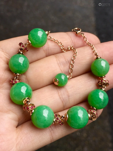 A Chinese Carved Jadeite Bracelet