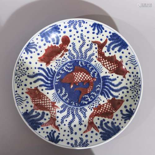 AN UNDERGLAZE BLUE AND COPPER RED GLAZE ALGAE AND DRAGON PLA...