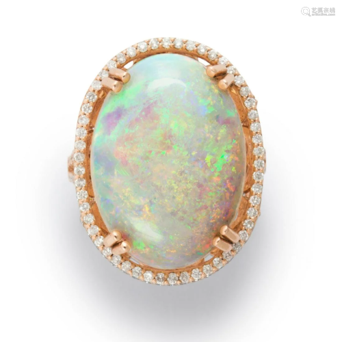 An opal, diamond and fourteen karat rose gold ring