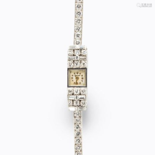 A Retro diamond and platinum bracelet watch, Cartier