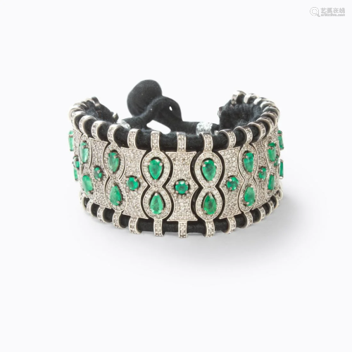 An emerald and diamond strap bracelet