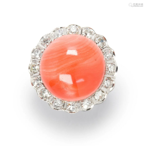 A coral, diamond and eighteen karat white gold ring