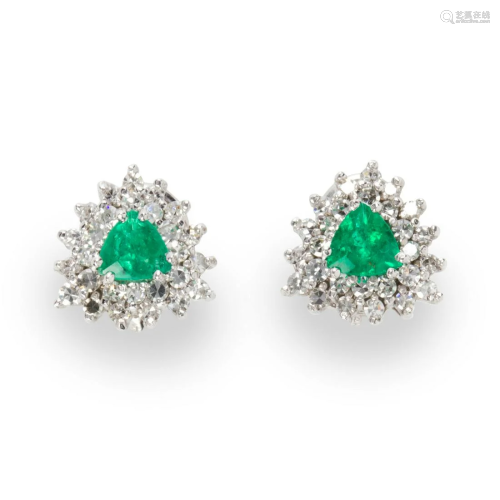 A pair of emerald, diamond and fourteen karat white