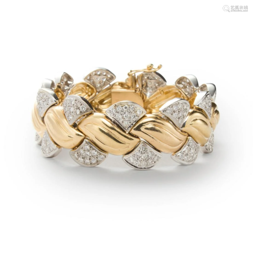 A diamond and fourteen karat bi-color gold bracelet