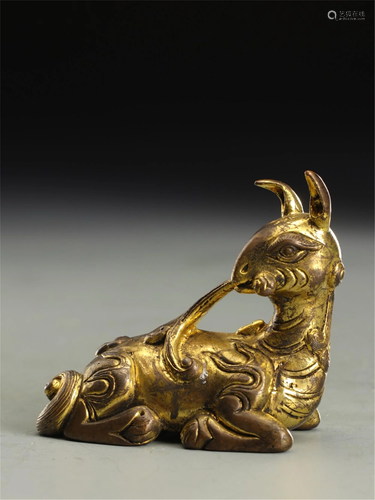 A BEAST SHAPED GILT BRONZE PAPERWEIGHT