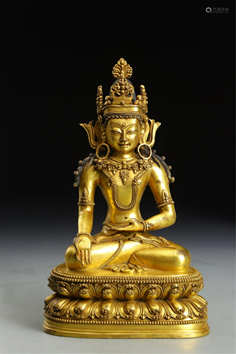 A GILT BRONZE SEATED AVALOKITESVARA