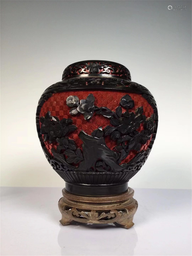 A CARVED LACQUER FLORAL TEA-LEAF CAN AND COVER