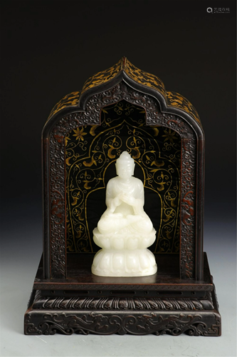 A JADE BUDDHA WITH A HARDWOOD BUDDHA NICHE