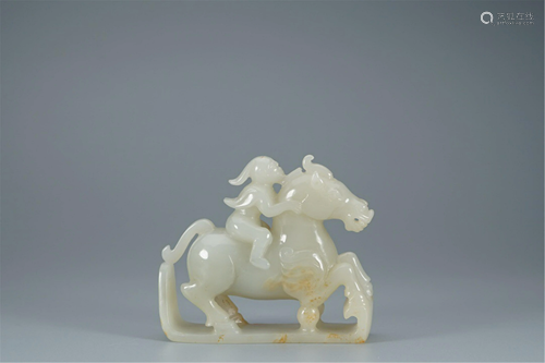 A JADE CARVING OF FIGURE ON HORSE