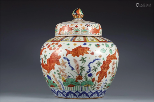 A WUCAI FISHES AND LOTUS PORCELAIN JAR AND COVER